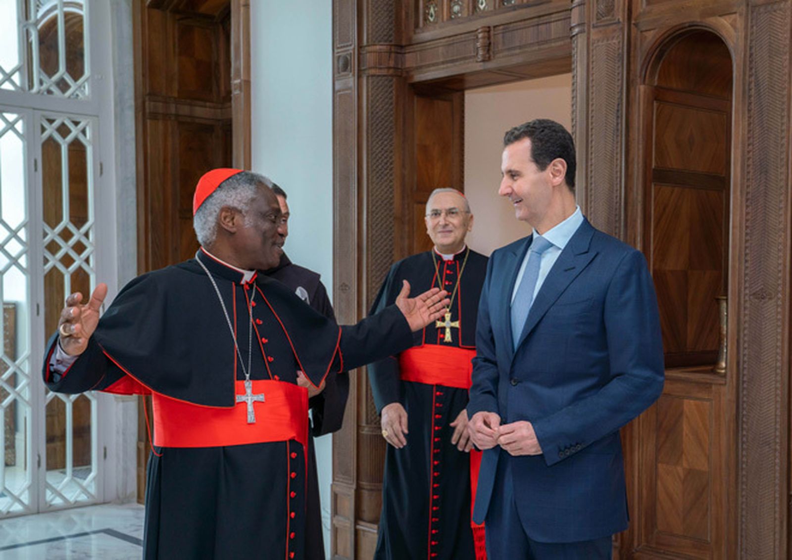 El cardenal Turkson y el presidente Assad