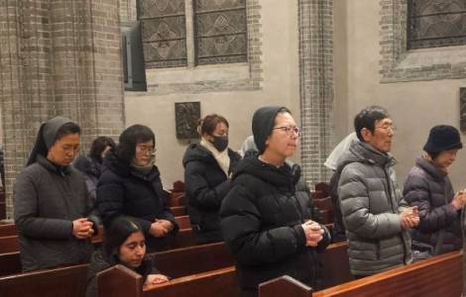 Asistentes a la misa por la reconciliación entre las dos Coreas