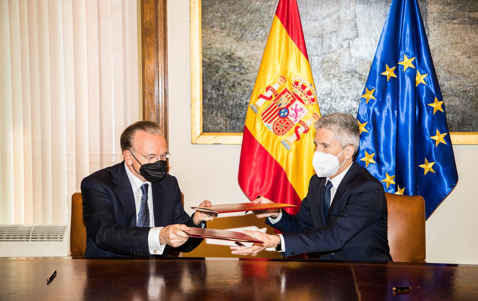 Grande-Marlaska y Fainé.