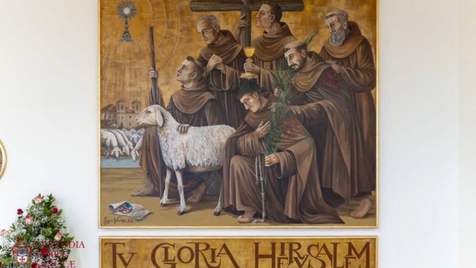 Imagen de religiosos franciscanos sobre la inscripción Tu Gloria Hierusalem.